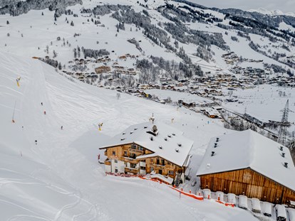 vacanza in fattoria - Skifahren - Lesach - Unsere Lage direkt an der Skipiste im Winter - Ferienwohnungen Perfeldhof