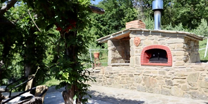 vacances à la ferme - Reiten - Blick auf unseren Pizzaofen und Grill - Agriturismo Casa Bivignano - Toskana
