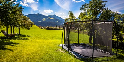 Urlaub auf dem Bauernhof - Almwirtschaft - Salzburg - Riesentrampolin 5mx3m - Baby- und Kinderferienbiobauernhof Sinnhubbauer